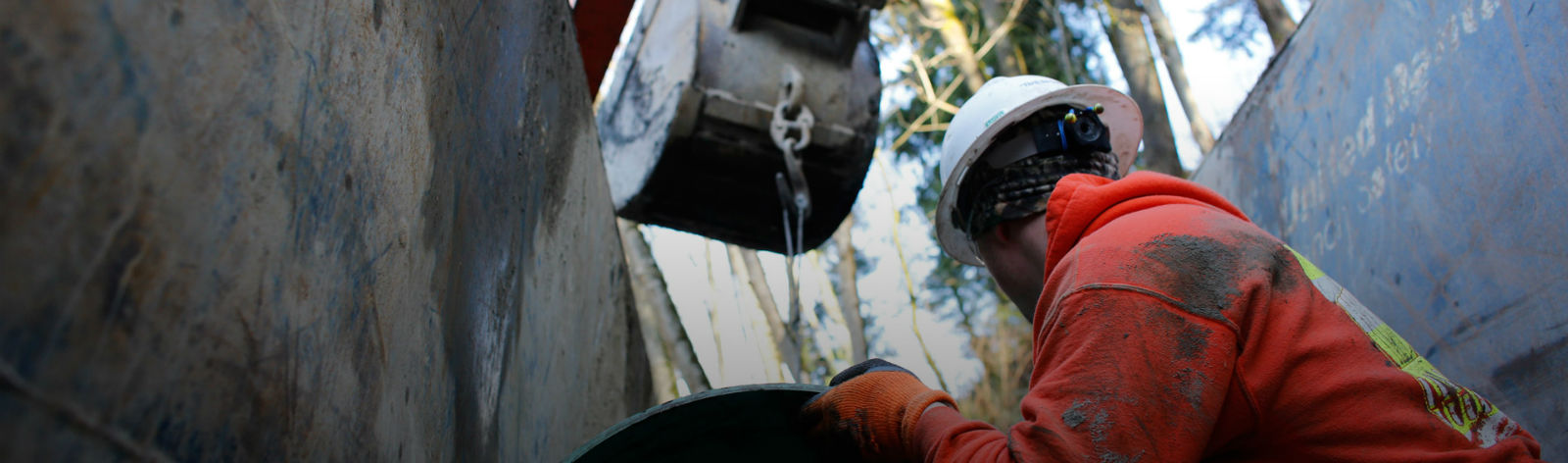 man lifting metal